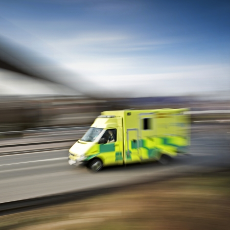 ambulance emergency response speeding along the motorwayの写真素材