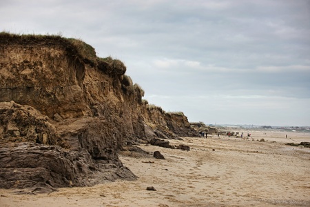 Beach with big bank of rock and sand from errosionの写真素材