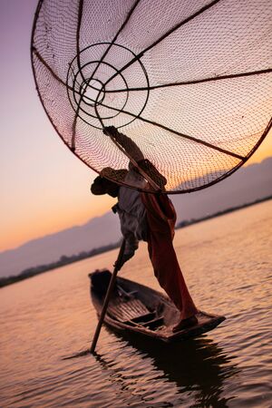 A Traditional Leg Rowing Fisherman of Inle Lake, Myanmar Burmaの写真素材