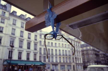 Paris, France, 1985 - Glasses found and hanging of a busstop in Paris