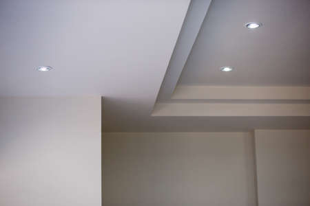 The walls and ceiling have just been painted white. Construction work of a bricklayer in Thailand. Background imageの写真素材