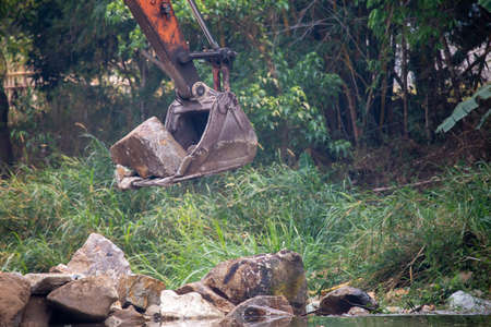 The truck is pouring stones. Pickup truck