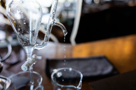 Distillation laboratory glassware liquid transparent droplet science chemistry alcohol experiment closeup focus equipment clean precise process clear beaker apparatus fluid research professional