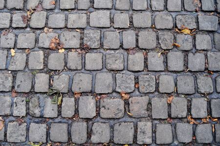 An old English cobbled street as background or textureの写真素材