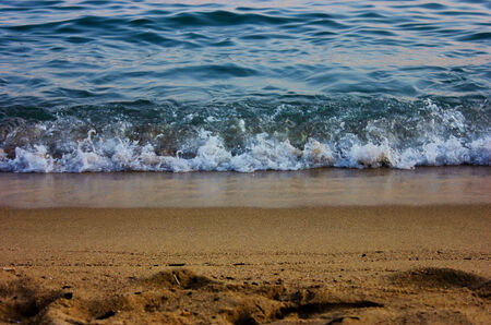 the movement of a wave on the beachの写真素材