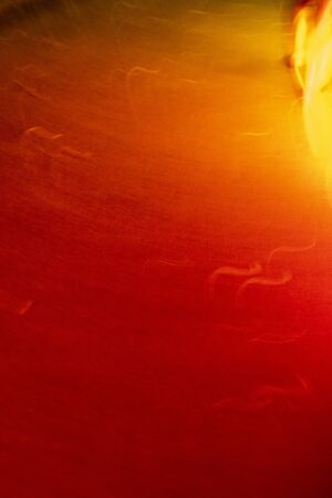 Portrait view of vivid blurred red and orange light