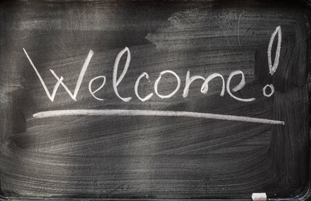 welcome on blackboard and chalks andの写真素材
