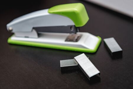 stapler, stapler pins, grey backgroundの写真素材