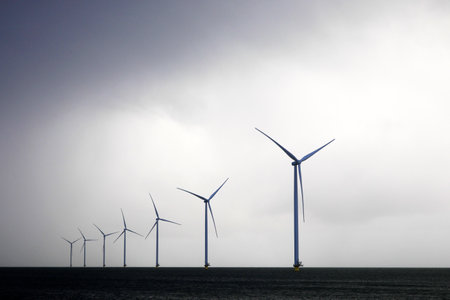 Beautiful cloudcape over wind turbine in the IJsselmeer, Holland