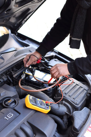 Car mechanic using an electronic device
