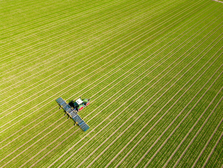 Aerial view of a dutch farmer working on his land, Flevoland, The Netherlands
