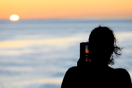 Passengers enjoying the sunset during a boat trip, The Netherlandsの写真素材