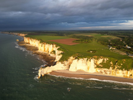The famous limestone cliffs near Etretat at sunset, Franceの写真素材
