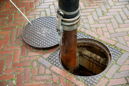 Clearing a sewage drain system