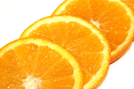 Orange Pieces On White Colored Backgroundの写真素材