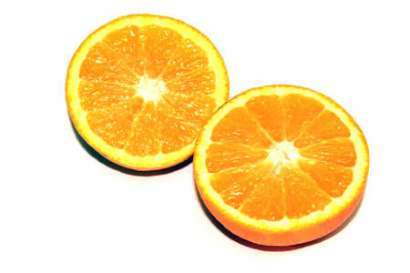 Orange Pieces On White Colored Backgroundの写真素材