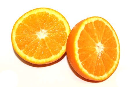 Orange Pieces On White Colored Backgroundの写真素材