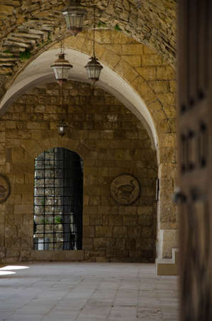 old church building stone wall through doorwayのeditorial素材