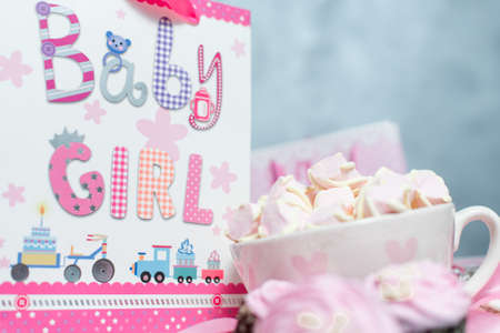 Maternity pregnancy background. Pink marshmellow and gift packの写真素材