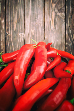 chili pepper on wood backgroundの写真素材