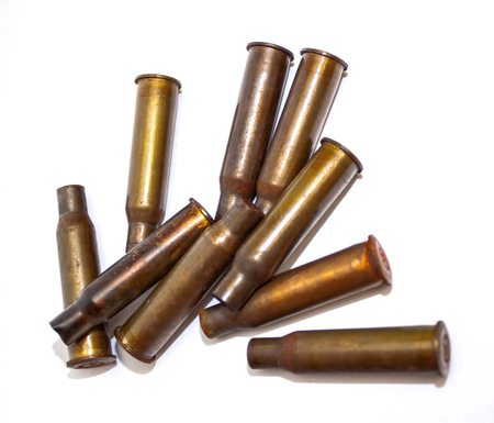 Empty bullet shells on a white background