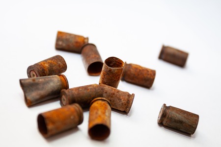Empty bullet shells on a white backgroundの写真素材