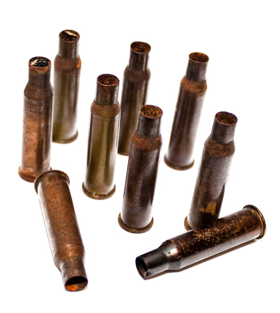 Empty bullet shells on a white background