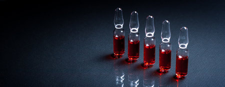 Ampoules with medical preparations or vaccine for injection on the tableの写真素材