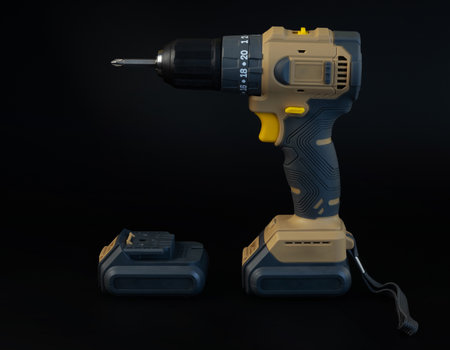 Cordless brushless screwdriver on black backgroundの写真素材