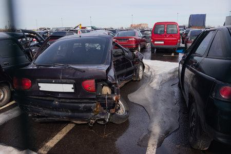 Broken and burnt cars after road accidents stand in a special parking lotの写真素材