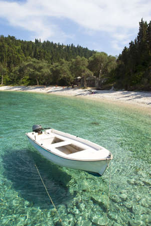 beautiful Greek beach with boat.の写真素材