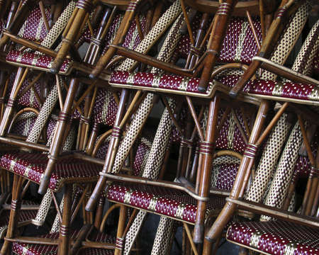a small restaurant in the city of Honfleur in Normandy France with stacked chairs prior to openingの写真素材
