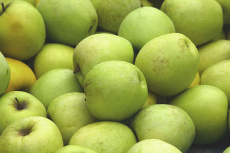 A Parisian market offers locally grown applesの写真素材