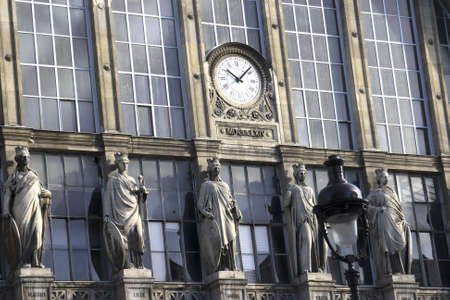 Paris train station with clock and statuesの写真素材