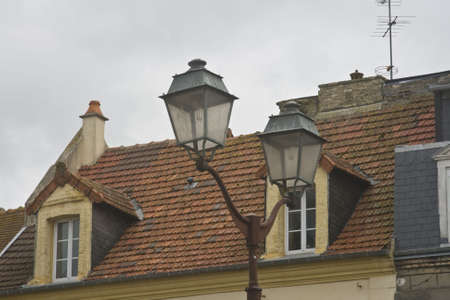 Historic French homes with street lightの写真素材