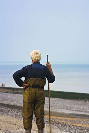 Fisherman in Normandy France looking over the sceneの写真素材
