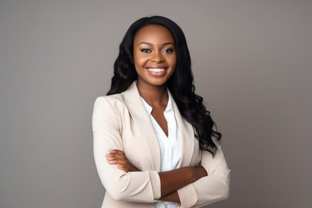 Portrait of beautiful african american businesswoman with arms crossedの素材