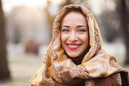 Smiling young and happy business woman wearing headscarfの写真素材