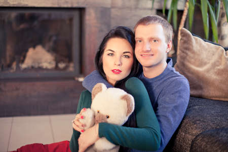 Happy young married couple in their house