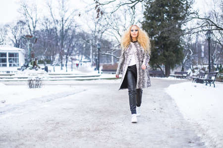 Blonde girl in the park on a winter dayの写真素材