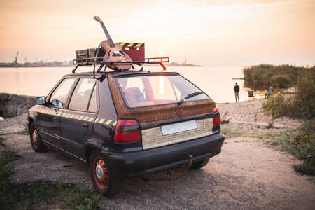 Old rusted hippie car freedom concept on coastの写真素材