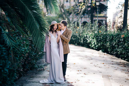 Young elegant fashion couple in parkの写真素材