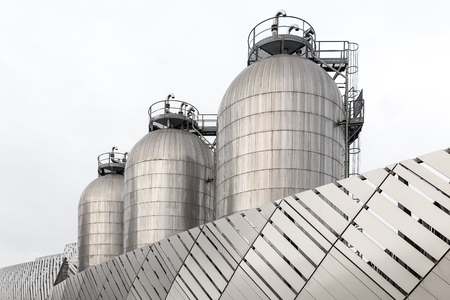 Close up of three industrial silos in stainless steel の写真素材