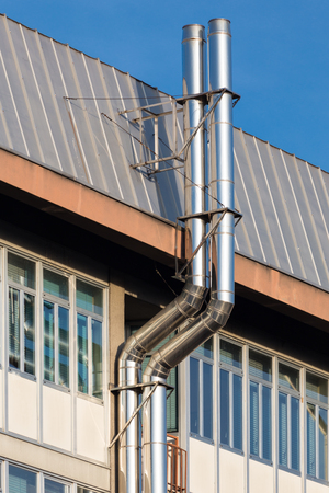 close up of two ventilation chimneys in stainless steel