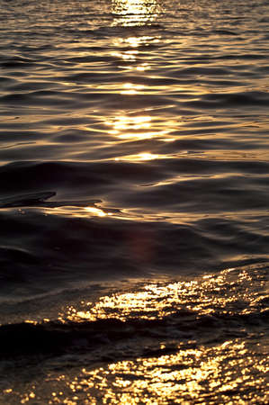 Sea water at sunsetの写真素材