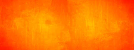 Dark orange yellow autumn colored painted abstract stone concrete paper texture background panorama...