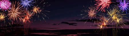 Silvester New Year Festival background banner panorama greeting card long- Colorful firework on dark...