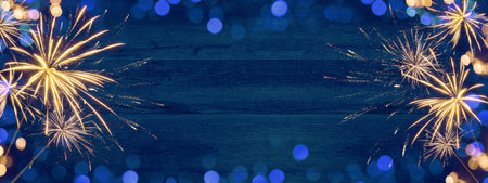 HAPPY NEW YEAR 2022 - Festive silvester firework background panorama greeting card banner long - Golden fireworks on dark blue wood wall textureの写真素材