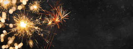 Silvester New Year Festival Party background banner panorama long- Golden firework, sparklers and...