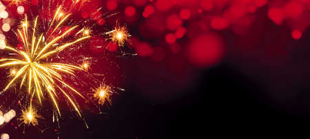 Happy new Year fireworks background greeting card - Colorful abstract firework with red bokeh lights in the dark black night, New Year's Eveの写真素材